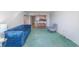 Comfortable living room with a blue couch, dining table, and easy access to the kitchen at 311 69Th Ave. N # 302, Myrtle Beach, SC 29572