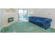 Cozy living room with fireplace, blue couch, and sliding doors to an outdoor balcony at 311 69Th Ave. N # 302, Myrtle Beach, SC 29572