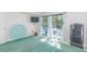 Well lit living room providing access to outdoor balcony, and tv at 311 69Th Ave. N # 302, Myrtle Beach, SC 29572