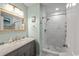 Stylish bathroom features a marble countertop vanity and walk-in shower with tiled walls at 312 35Th Ave. N, North Myrtle Beach, SC 29582