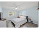 Comfortable bedroom featuring a ceiling fan, natural light, and cozy decor at 312 35Th Ave. N, North Myrtle Beach, SC 29582