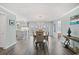 Dining room with modern lighting and comfortable seating, adjacent to the open kitchen at 312 35Th Ave. N, North Myrtle Beach, SC 29582