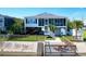 Charming waterfront home features a fenced yard, dock, and inviting exterior at 312 35Th Ave. N, North Myrtle Beach, SC 29582