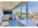 Relaxing screened-in porch with outdoor seating, canal view, and scenic waterfront at 312 35Th Ave. N, North Myrtle Beach, SC 29582