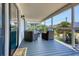 Relaxing screened-in porch with comfortable seating, perfect for enjoying the outdoors at 312 35Th Ave. N, North Myrtle Beach, SC 29582