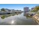 Beautiful waterfront view showcases the house and community canal setting at 312 35Th Ave. N, North Myrtle Beach, SC 29582