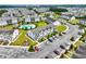 Aerial view of condo community highlighting the manicured lawns, ample parking, and a refreshing outdoor pool at 318 Castle Dr. # 1443, Myrtle Beach, SC 29579