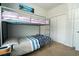 Cozy bedroom with bunk beds, closet, and carpet flooring at 318 Castle Dr. # 1443, Myrtle Beach, SC 29579