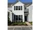 Charming two-story home with black shutters and landscaped yard at 318 Castle Dr. # 1443, Myrtle Beach, SC 29579