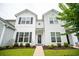 Well-maintained two-story home with neat landscaping and paved walkway at 318 Castle Dr. # 1443, Myrtle Beach, SC 29579