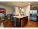 Modern kitchen with granite countertops, stainless steel appliances, and island seating at 318 Castle Dr. # 1443, Myrtle Beach, SC 29579