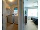 Laundry room with washer and dryer hookups adjacent to the bedroom for added convenience at 318 Castle Dr. # 1443, Myrtle Beach, SC 29579