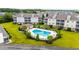 Relax by the community pool, surrounded by lush landscaping, lounge chairs and umbrellas, for the ultimate in outdoor living at 318 Castle Dr. # 1443, Myrtle Beach, SC 29579
