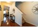 Entryway with a carpeted staircase and hardwood floors, leading to an inviting and stylish living space at 318 Castle Dr. # 1443, Myrtle Beach, SC 29579