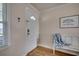Welcoming entryway with wood-look flooring, a white door, a window, and a bench with beach-themed decor at 321 53Rd Ave. N, North Myrtle Beach, SC 29582