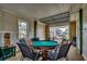 Entertaining game room with poker table, garage door access to waterfront views, and convenient first floor access at 321 53Rd Ave. N, North Myrtle Beach, SC 29582