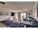 Inviting living room featuring a comfortable blue sectional, modern decor, and access to an outdoor patio at 321 53Rd Ave. N, North Myrtle Beach, SC 29582