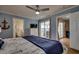 Cozy main bedroom features soft blue walls, TV, and access to balcony at 321 53Rd Ave. N, North Myrtle Beach, SC 29582