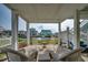 Relaxing outdoor lounge area with seating offering a serene canal view and access to the main home at 321 53Rd Ave. N, North Myrtle Beach, SC 29582