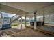 Spacious outdoor patio with stairs to the main house, bar with seating, and canal views at 321 53Rd Ave. N, North Myrtle Beach, SC 29582