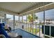 Relaxing screened porch with comfortable seating and views of the neighborhood at 321 53Rd Ave. N, North Myrtle Beach, SC 29582