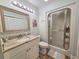 Bright bathroom features a vanity, stand-up shower, and wood-look flooring at 323 Wendover Ct. # 10-A, Myrtle Beach, SC 29572