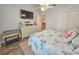 Comfortable bedroom with a TV, dresser, flamingo-themed bedding, and closet at 323 Wendover Ct. # 10-A, Myrtle Beach, SC 29572