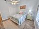 Bright bedroom with a ceiling fan, flamingo-themed decor, and closet at 323 Wendover Ct. # 10-A, Myrtle Beach, SC 29572