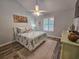 Charming bedroom featuring a ceiling fan, flamingo decor, and wood-look flooring at 323 Wendover Ct. # 10-A, Myrtle Beach, SC 29572