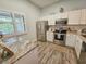 Bright kitchen with stainless steel appliances, white cabinetry, and tile backsplash at 323 Wendover Ct. # 10-A, Myrtle Beach, SC 29572