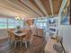 Open-concept dining and living room with wood floors, fireplace, and neutral decor at 323 Wendover Ct. # 10-A, Myrtle Beach, SC 29572