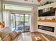 Comfortable living room with fireplace and a sliding glass door leading to a patio at 323 Wendover Ct. # 10-A, Myrtle Beach, SC 29572