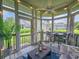 Relaxing screened porch with outdoor seating and views of the surrounding landscape at 323 Wendover Ct. # 10-A, Myrtle Beach, SC 29572