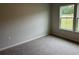 Cozy bedroom with carpet and a window providing view of the outdoors at 3333 Sw Wood Stork Dr., Ocean Isle Beach, NC 28469