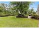 Expansive backyard with lush green grass and a charming brick patio for entertaining at 341 Bahama Dr., Murrells Inlet, SC 29576