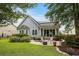 Cozy backyard showcasing brick patio, outdoor seating, and well-maintained lawn at 341 Bahama Dr., Murrells Inlet, SC 29576