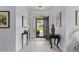 Welcoming foyer with tiled flooring, elegant console tables, and a view of the covered front porch at 341 Bahama Dr., Murrells Inlet, SC 29576
