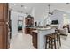 Open kitchen with granite countertops, breakfast bar, stainless appliances and seamless flow to other living areas at 341 Bahama Dr., Murrells Inlet, SC 29576