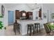 Open-concept kitchen featuring a breakfast bar with granite countertops and modern stainless steel appliances at 341 Bahama Dr., Murrells Inlet, SC 29576