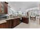 Gourmet kitchen boasts granite countertops, stainless steel appliances, and dark cabinetry for a sleek design at 341 Bahama Dr., Murrells Inlet, SC 29576