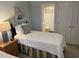 A guest bedroom features beach-themed decor with two twin beds, providing a serene coastal retreat at 371 S Dunes Dr., Pawleys Island, SC 29585
