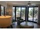 Bright and airy living room featuring large glass doors leading to an outdoor balcony at 371 S Dunes Dr., Pawleys Island, SC 29585