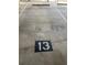 Designated parking spot for the property with clearly visible number 13, ideal for easy access at 371 S Dunes Dr., Pawleys Island, SC 29585