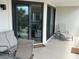 Comfortable outdoor seating on the patio with view to indoor living space at 371 S Dunes Dr., Pawleys Island, SC 29585