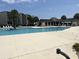Community pool offers a refreshing retreat with ample space for swimming and lounging in the sun at 371 S Dunes Dr., Pawleys Island, SC 29585