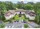 Overhead view of a tan apartment complex featuring well-manicured grounds and convenient parking at 405 Pipers Ln. # 405, Myrtle Beach, SC 29575