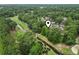An aerial view of the apartment complex and golf course with a stream at 405 Pipers Ln. # 405, Myrtle Beach, SC 29575