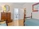 Comfortable bedroom with wood furniture, dresser, and access to a private bathroom at 405 Pipers Ln. # 405, Myrtle Beach, SC 29575