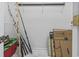 A useful closet with a fishing kayak, fishing poles, banker boxes, and shelving at 405 Pipers Ln. # 405, Myrtle Beach, SC 29575
