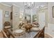 Open concept dining area showcasing a table with shell decor and partial views of other rooms at 405 Pipers Ln. # 405, Myrtle Beach, SC 29575